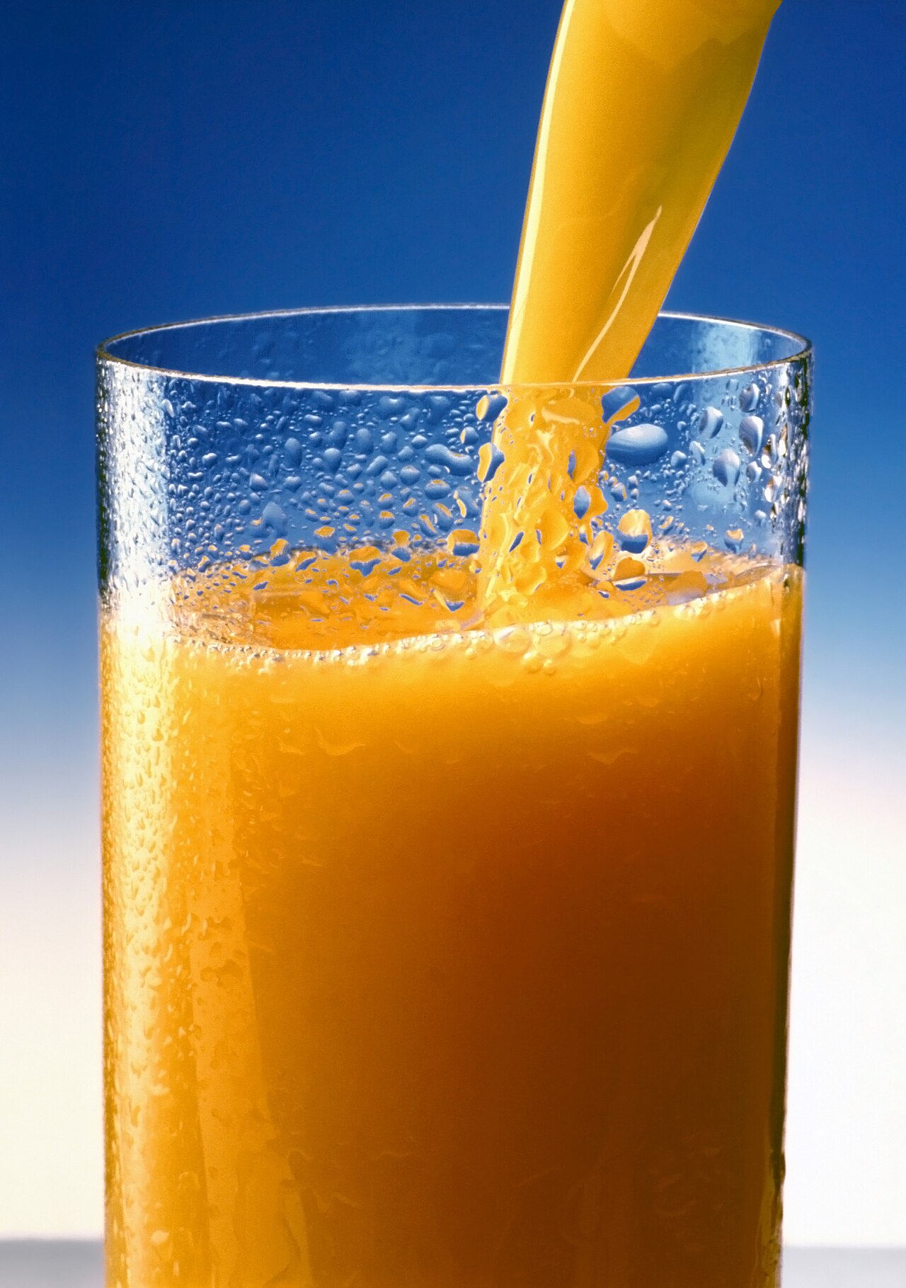Fresh orange juice in a tall glass at Gul Café, Dubai Investment Park