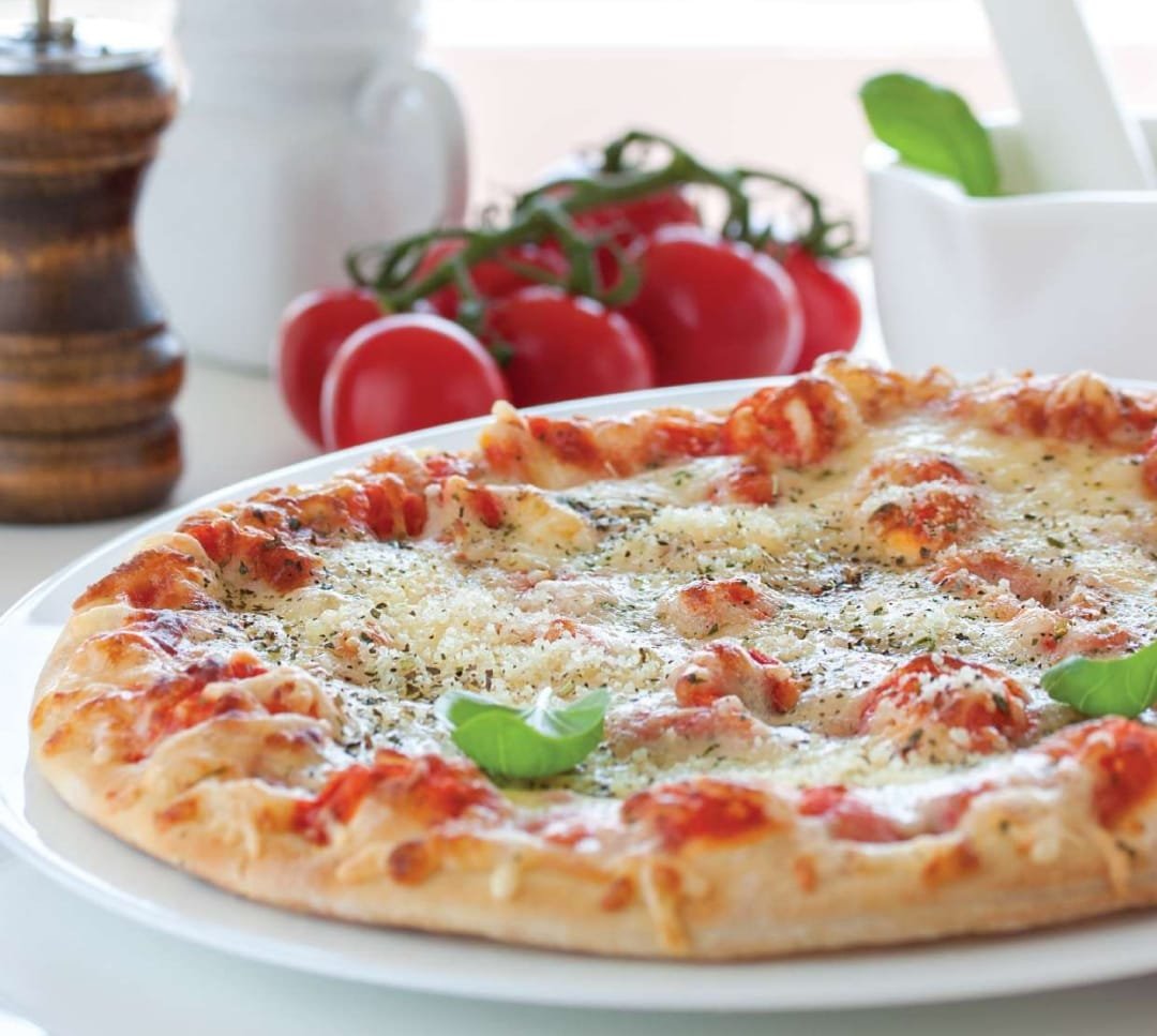 Freshly baked margherita pizza at Gul Café, Dubai Investment Park