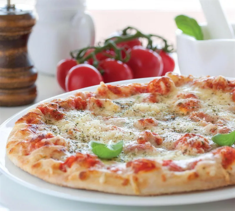 Freshly baked margherita pizza at Gul Cafe, Dubai Investment Park