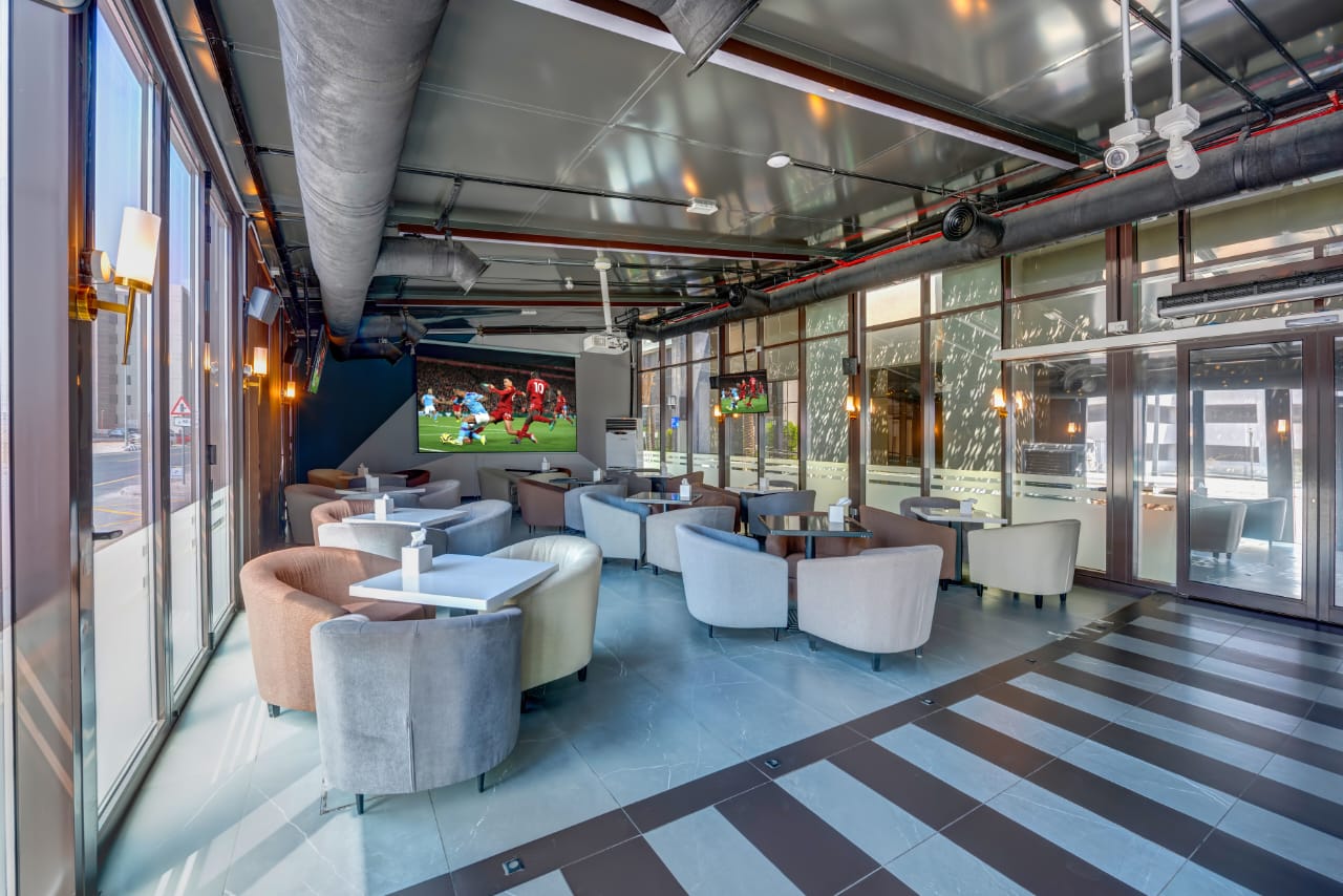 Gul shisha lounge in Dubai Investment Park (DIP 1) with big screen showing live football